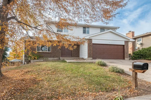 a kitchen with stainless steel appliances granite countertop sink stove top oven and cabinets