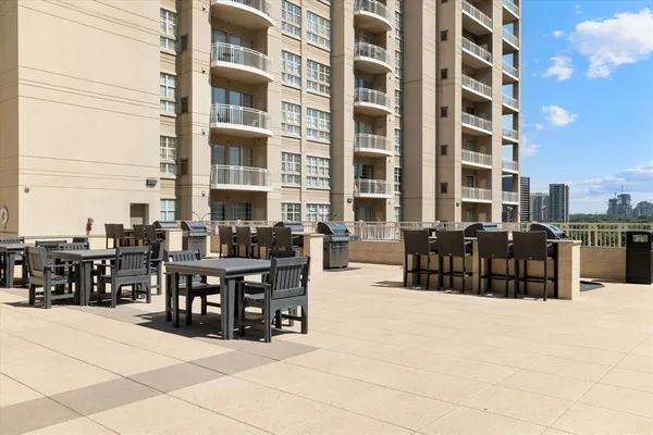 a outdoor space with lots of tables a garden and chairs