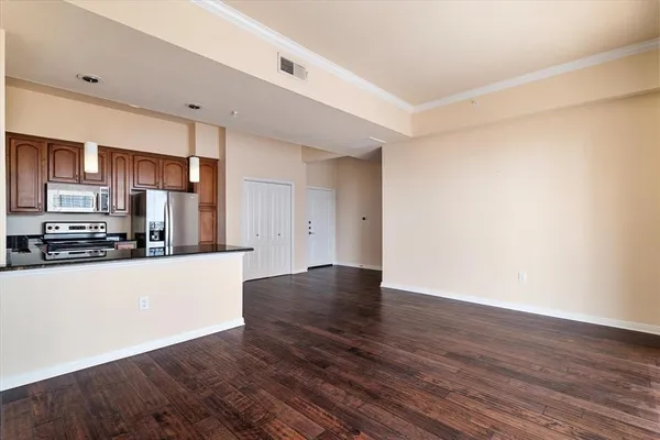a view of kitchen with wooden floor