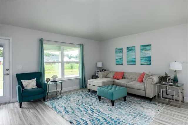 a living room with furniture and a window