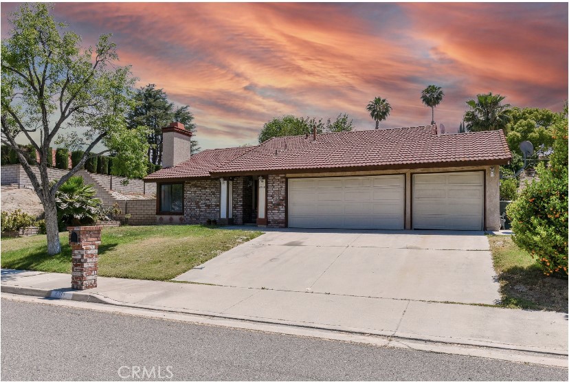 6318 Westview Drive Riverside, CA 92506 - Photo 1 of 17 a front view of a house with a yard and a garage