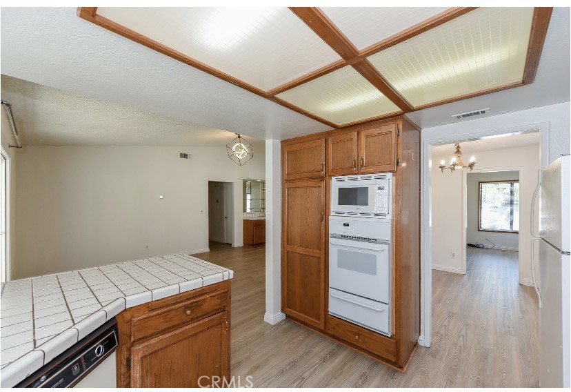 6318 Westview Drive Riverside, CA 92506 - Photo 13 of 17 a kitchen with a refrigerator and countertop