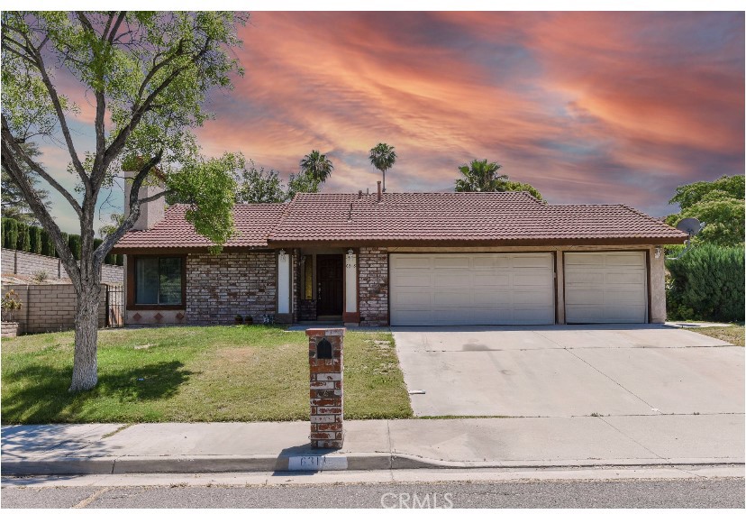 6318 Westview Drive Riverside, CA 92506 - Photo 2 of 17 a front view of a house with a yard and garage