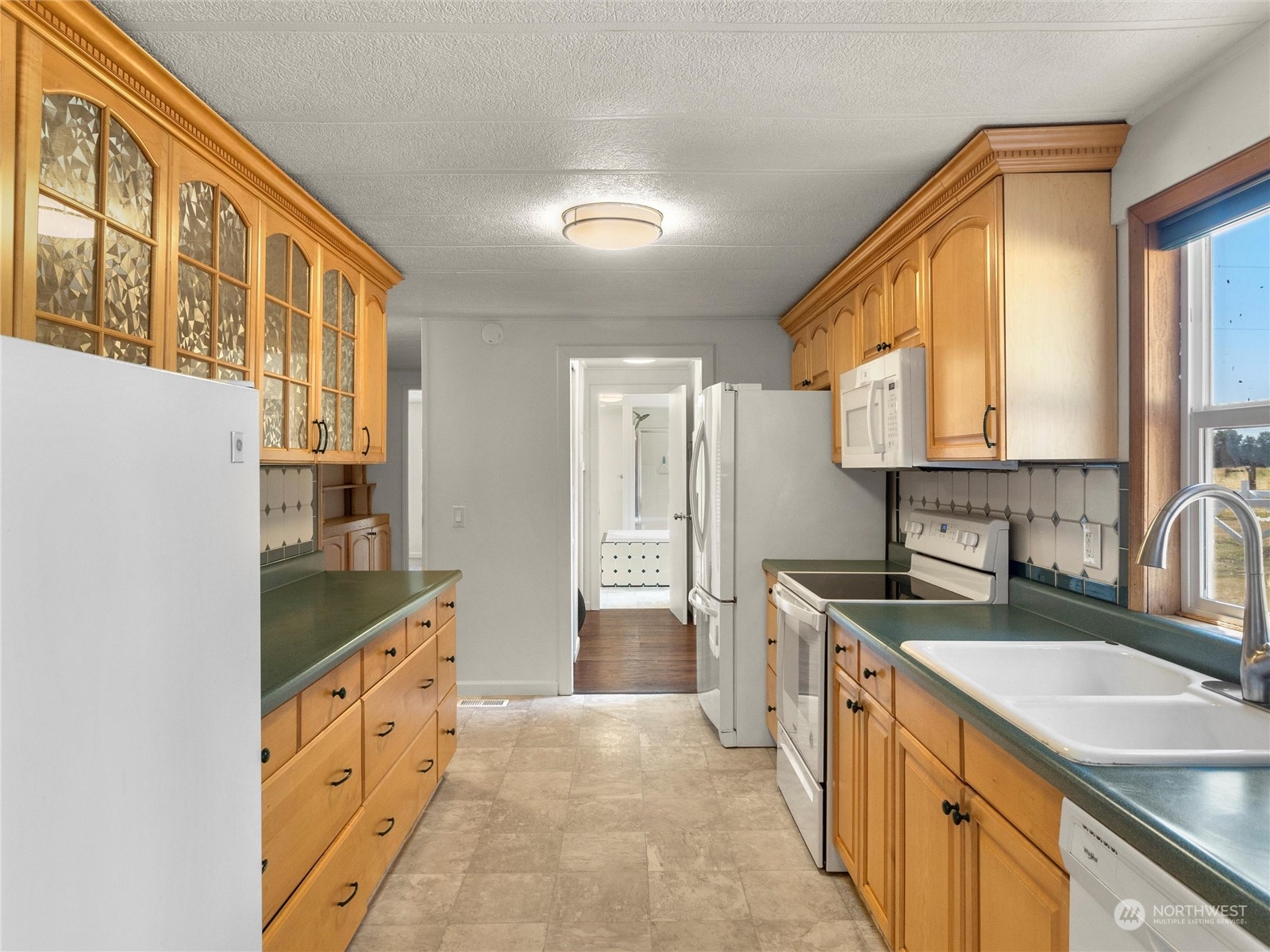 17929 Leitner Road Southwest Rochester, WA 98579 - Photo 11 of 40 a spacious bathroom with a granite countertop double vanity sink a mirror and a shower
