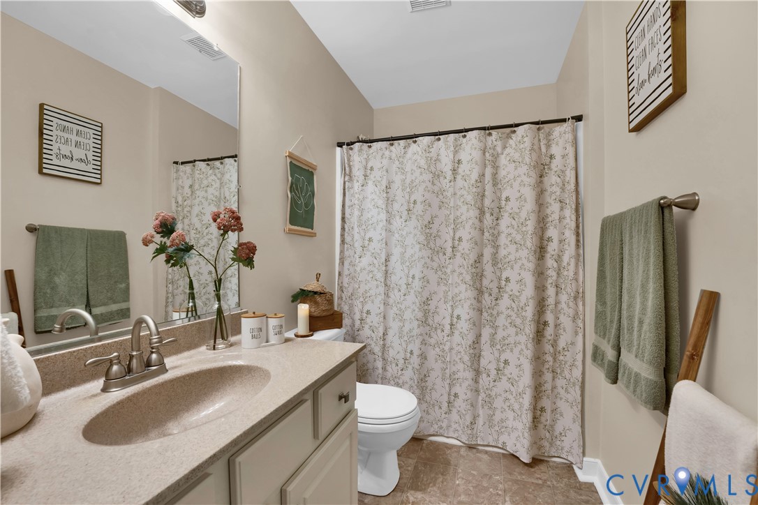 16148 Buckfast Place Beaverdam, VA 23015 - Photo 30 of 48 a bathroom with a granite countertop sink toilet and shower