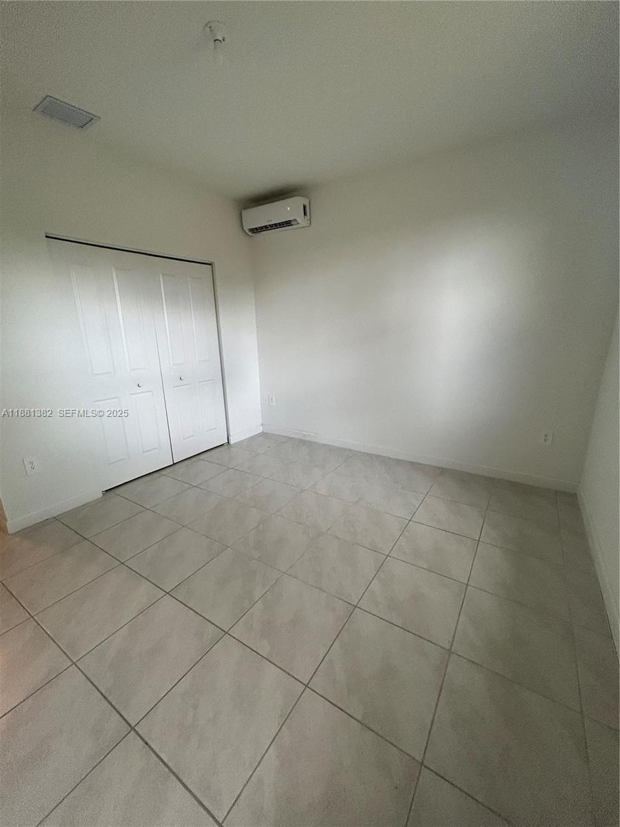 24030 Southwest 119th Place Homestead, FL 33032 - Photo 13 of 15 a view of an empty room