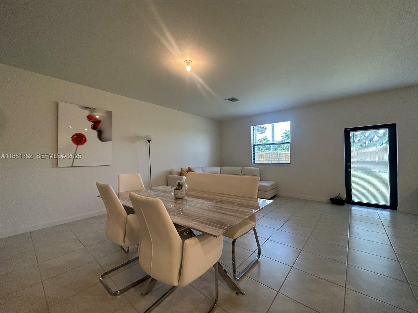 24030 Southwest 119th Place Homestead, FL 33032 - Photo 3 of 15 a view of a livingroom with furniture and window
