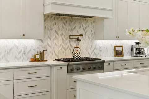 a bathroom with a granite countertop sink a mirror and a shower