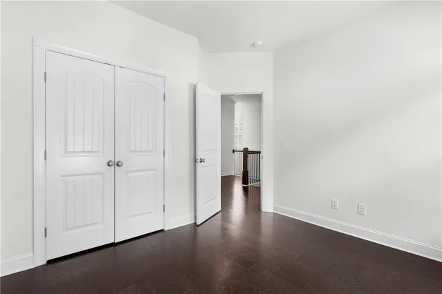 an empty room with wooden floor