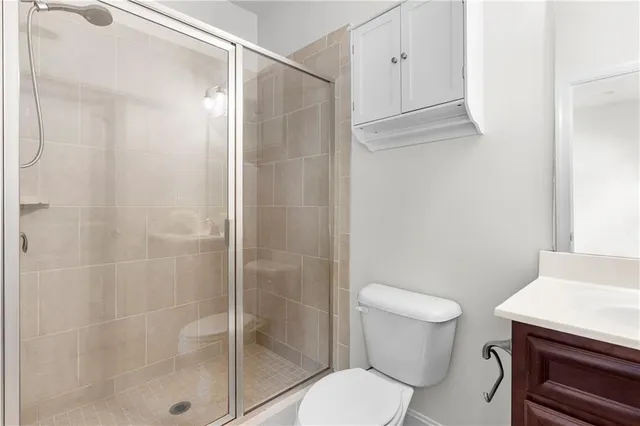 a bathroom with a shower and a toilet