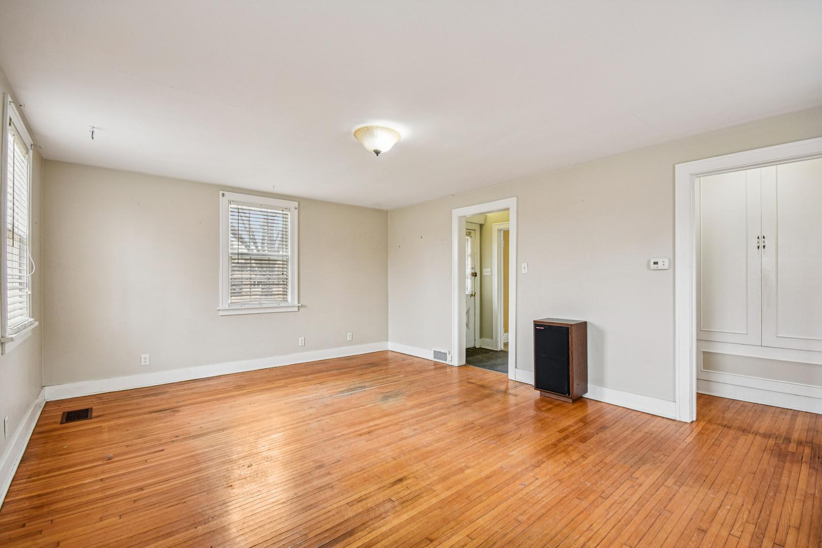 1246 Wauponsee Street Morris, IL 60450 - Photo 15 of 45 a view of empty room with wooden floor and fan