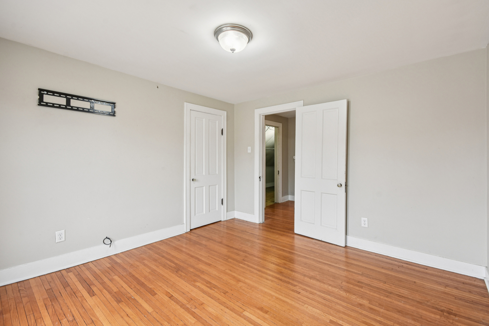 1246 Wauponsee Street Morris, IL 60450 - Photo 21 of 45 a view of an empty room with wooden floor