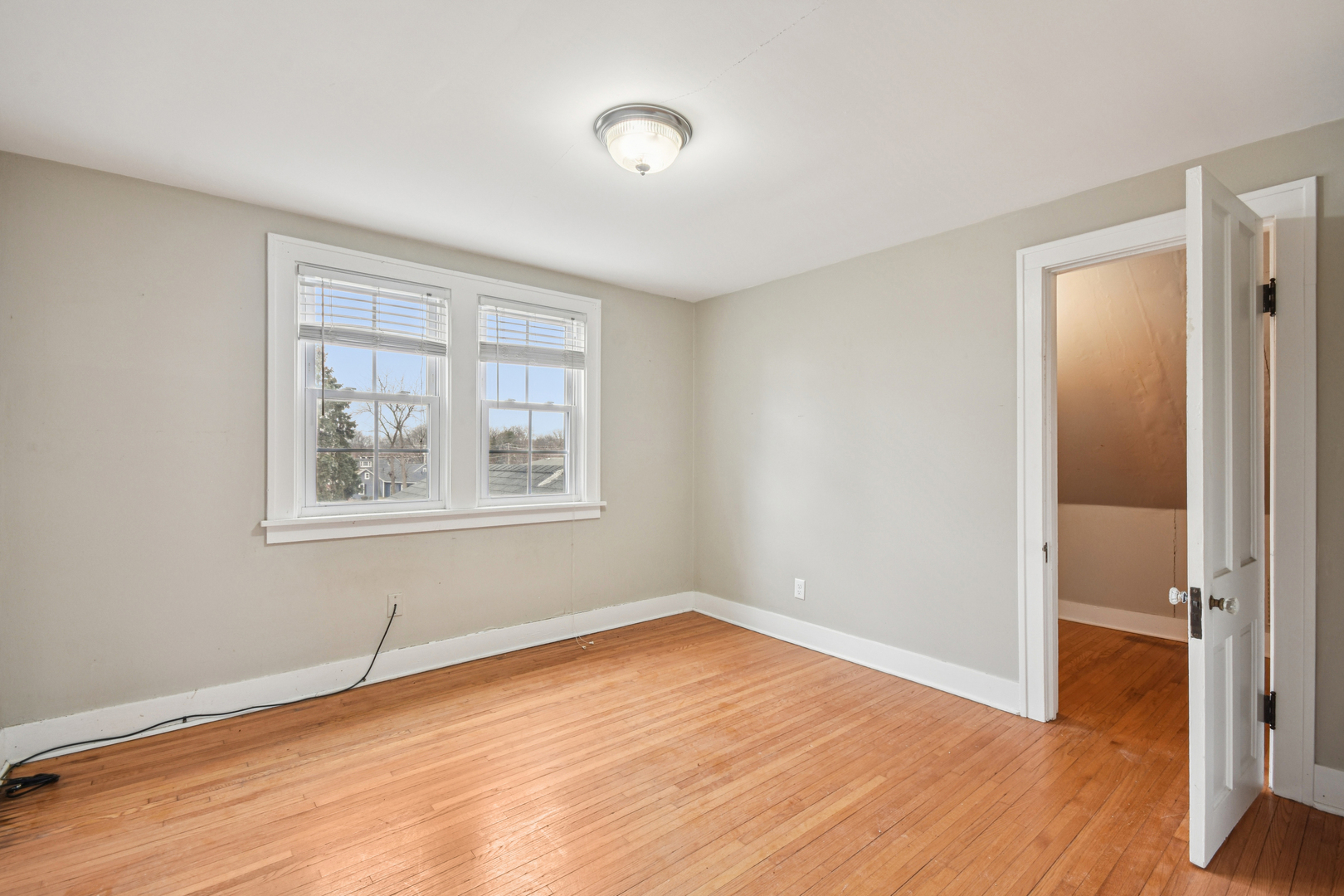 1246 Wauponsee Street Morris, IL 60450 - Photo 23 of 45 an empty room with wooden floor and windows