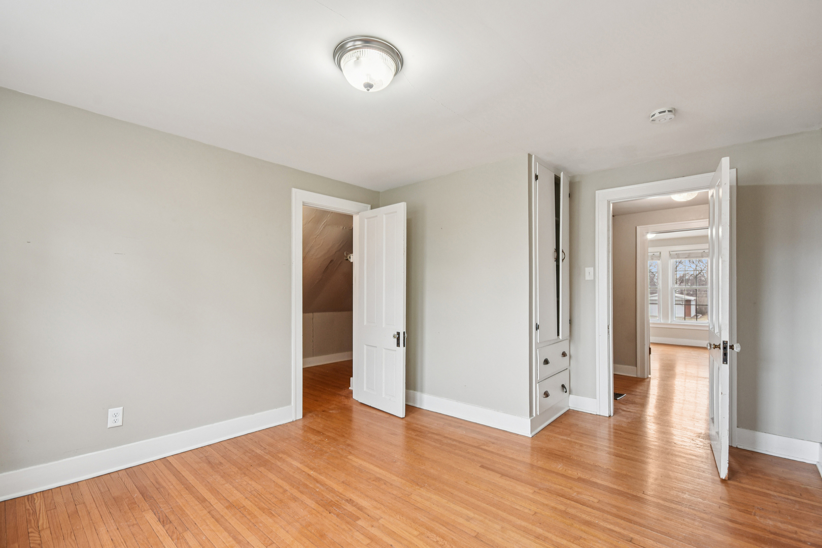 1246 Wauponsee Street Morris, IL 60450 - Photo 24 of 45 an empty room with wooden floor and windows