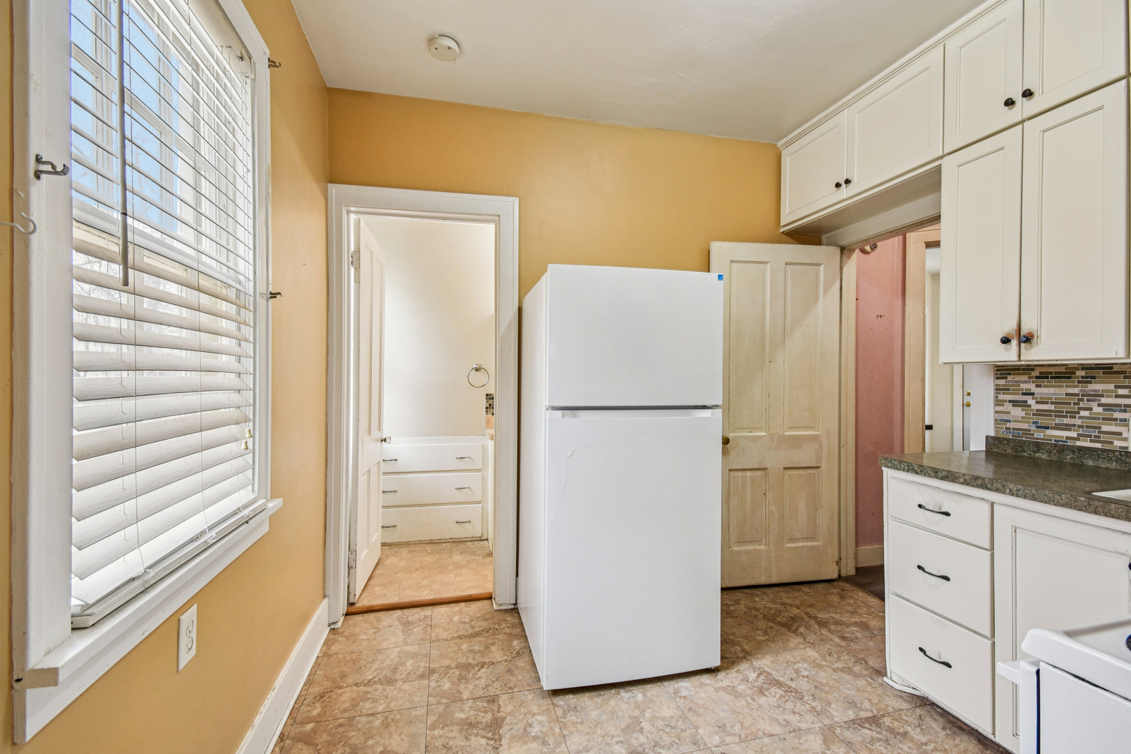1246 Wauponsee Street Morris, IL 60450 - Photo 29 of 45 a kitchen with refrigerator cabinets and wooden floor