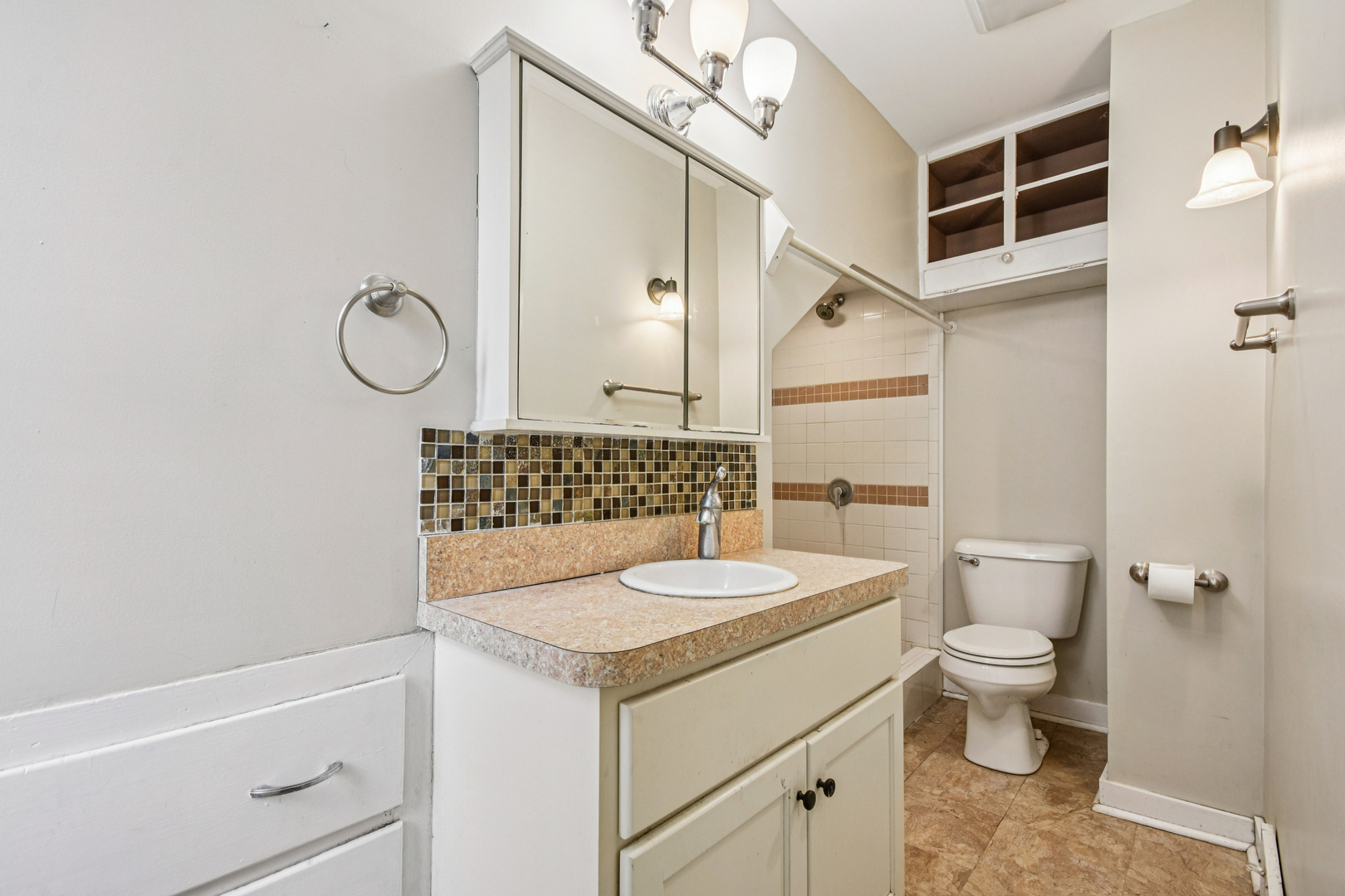 1246 Wauponsee Street Morris, IL 60450 - Photo 30 of 45 a bathroom with a sink a toilet and shower