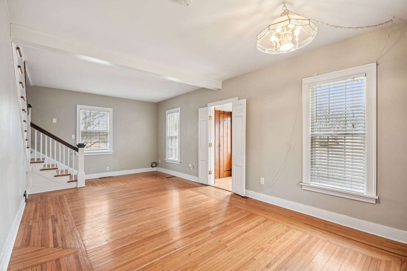 1246 Wauponsee Street Morris, IL 60450 - Photo 7 of 45 a view of an empty room with wooden floor and a window
