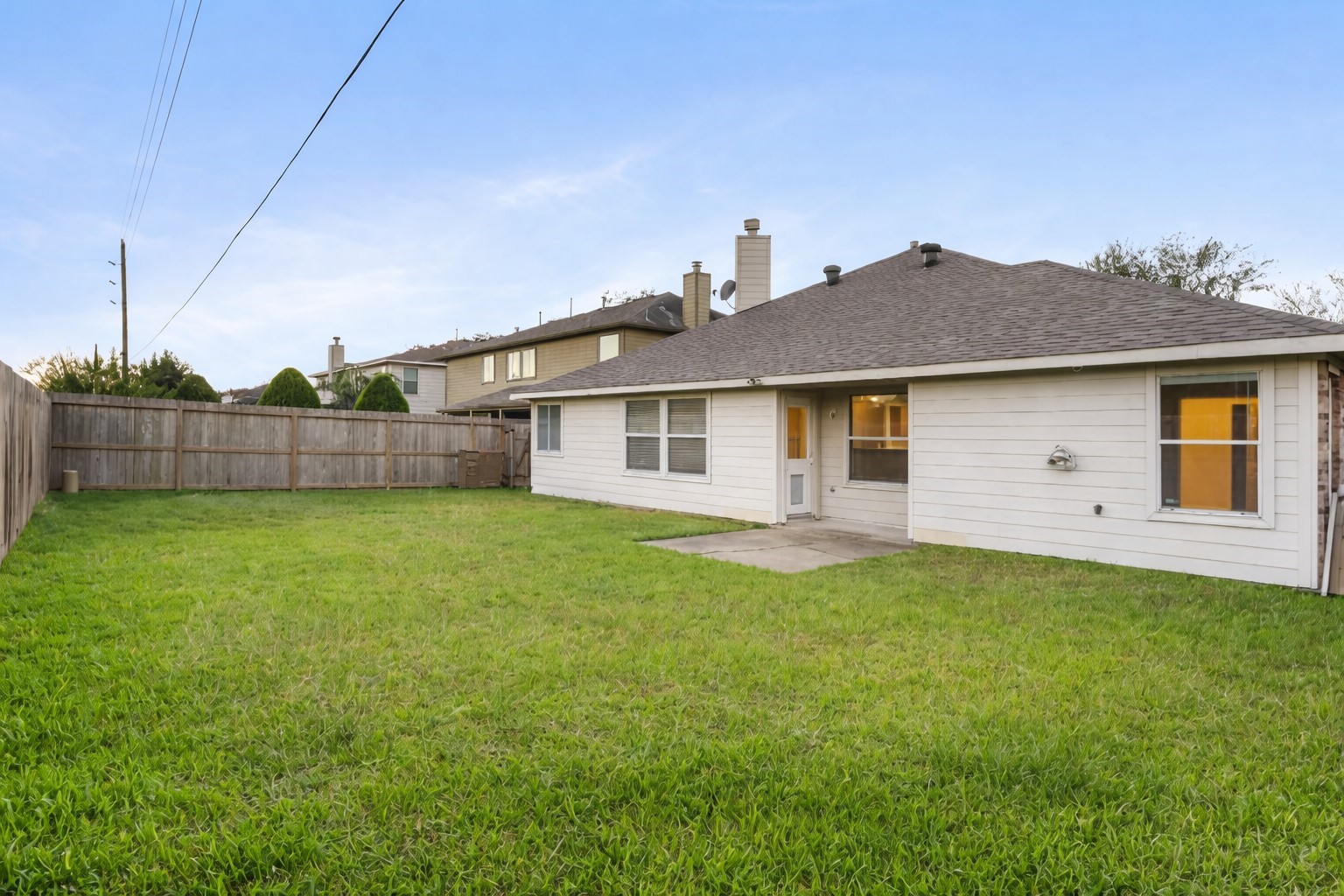 3522 Brackenfern Road Katy, TX 77449 - Photo 16 of 17 a backyard of a house with table and chairs