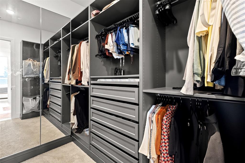 1825 Rough Rdg Trail Midlothian, TX 76065 - Photo 22 of 37 Custom closet system featuring dark cabinetry, multiple drawers, shelving, and extensive hanging rods