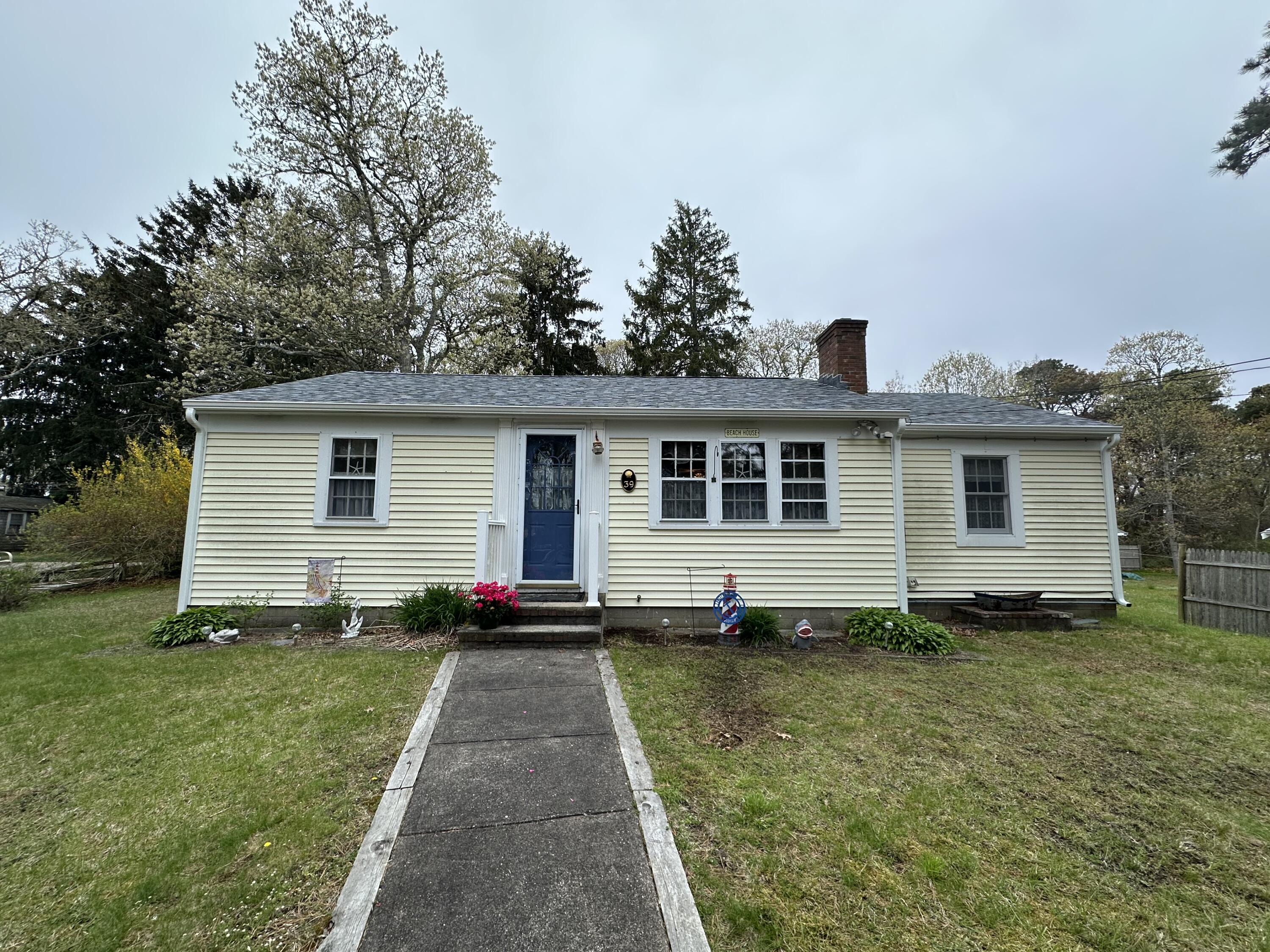 39 Naushon Road Dennis Port, MA 02639 - Photo 1 of 24 a front view of house with yard
