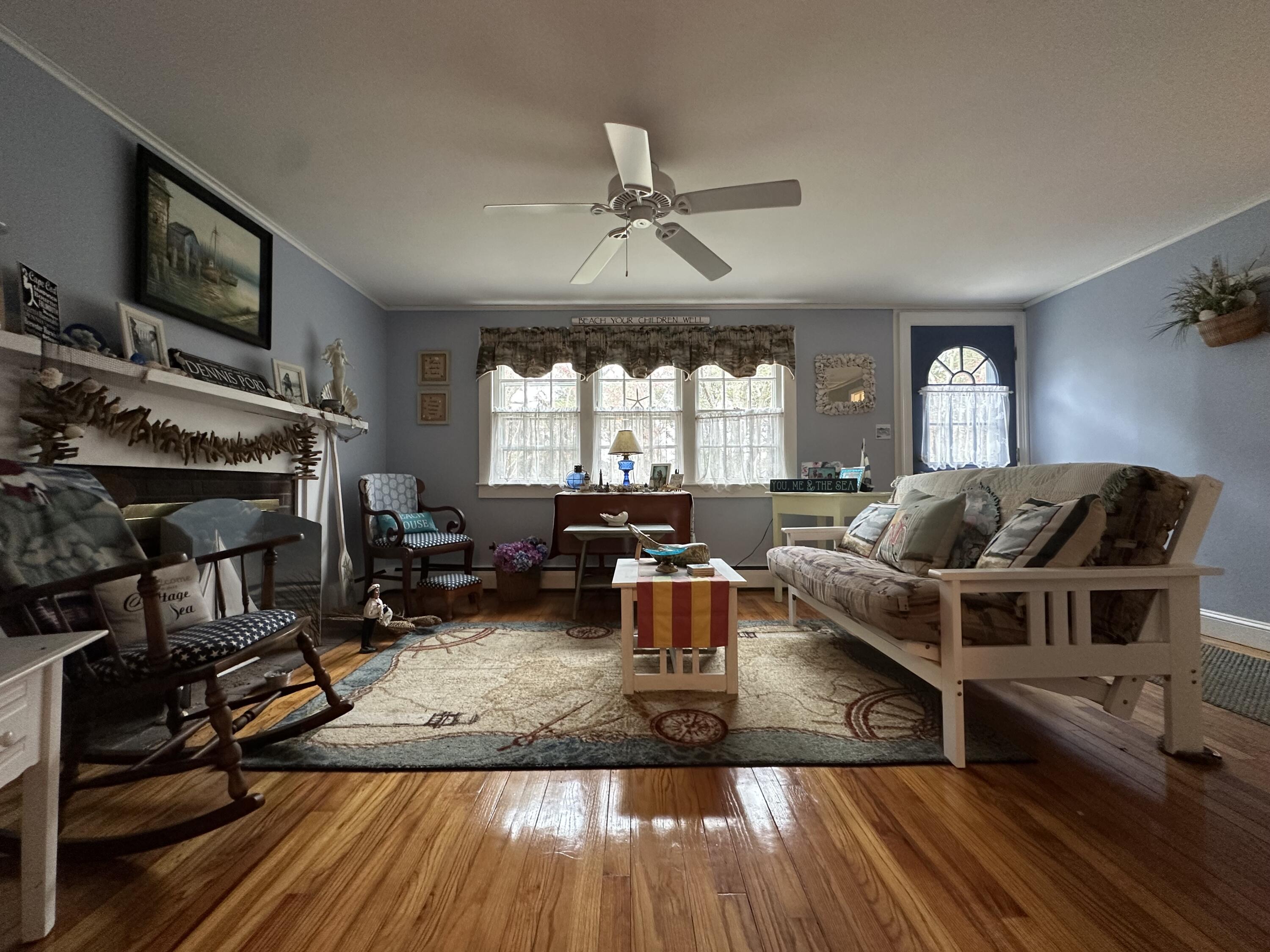 39 Naushon Road Dennis Port, MA 02639 - Photo 6 of 24 a living room with furniture and a wooden floor
