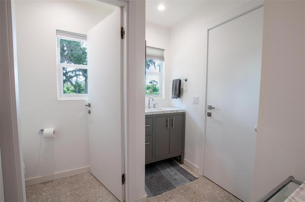 1635 Southwest Rodgers Avenue Arcadia, FL 34266 - Photo 19 of 32 a bathroom with a sink a mirror and a window