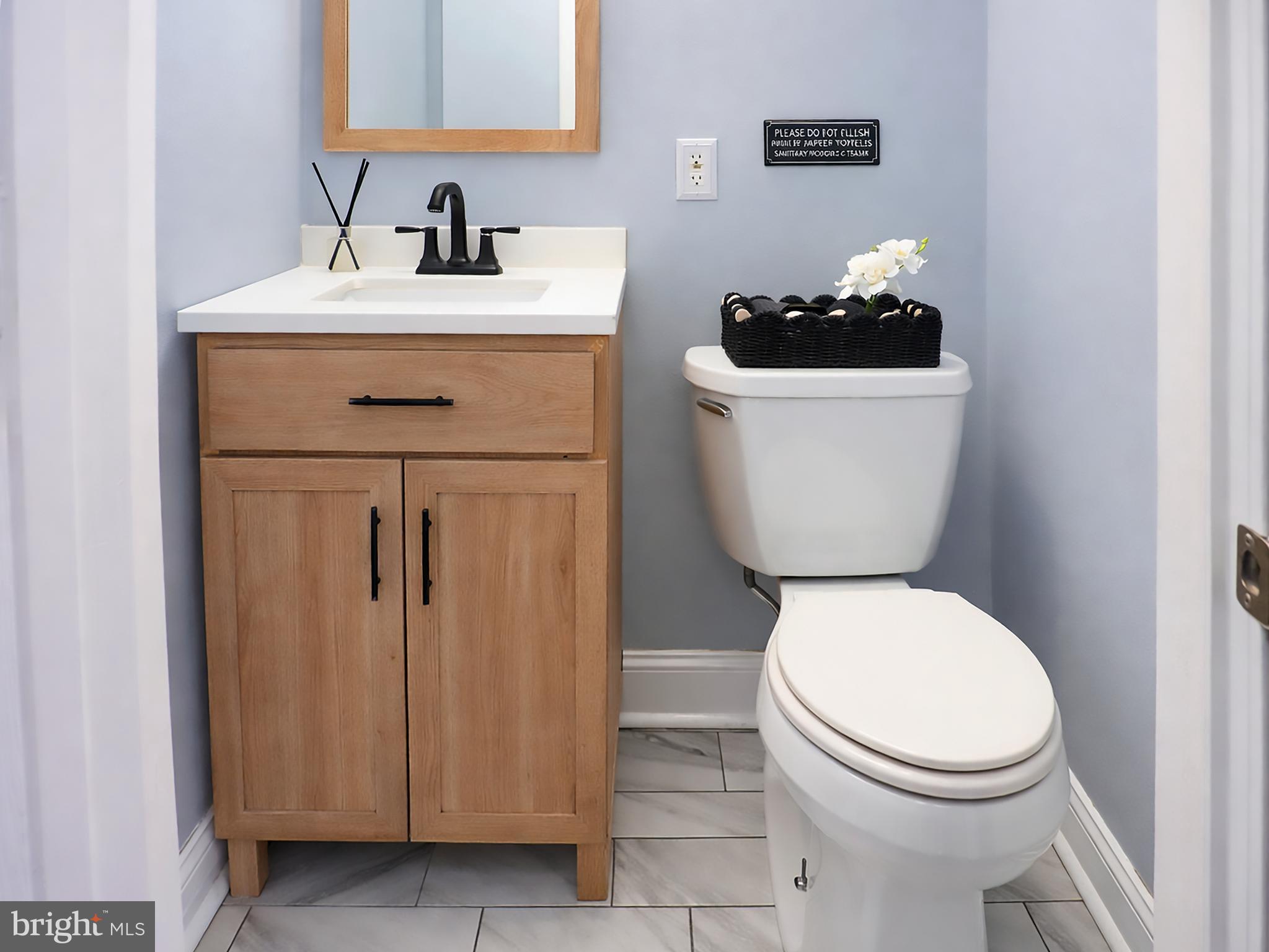 3935 Clay Place Northeast Washington, DC 20019 - Photo 11 of 17 a white toilet sitting next to a bathroom sink