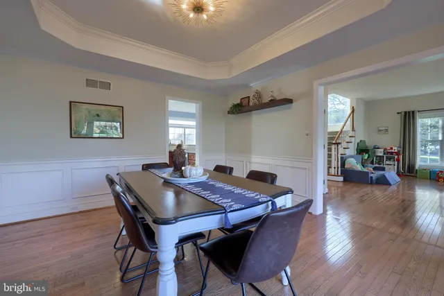 a kitchen with kitchen island granite countertop a sink cabinets and stainless steel appliances