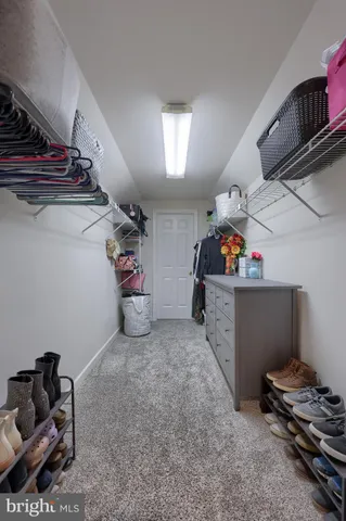 a bathroom with double sink and a mirror