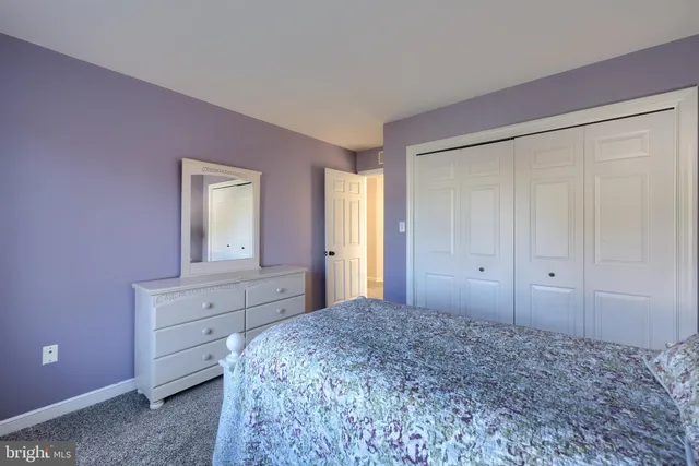 a view of a patio with couches and a table and chairs with garden view