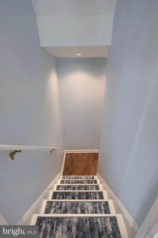 a view of a house with backyard sitting area and garden