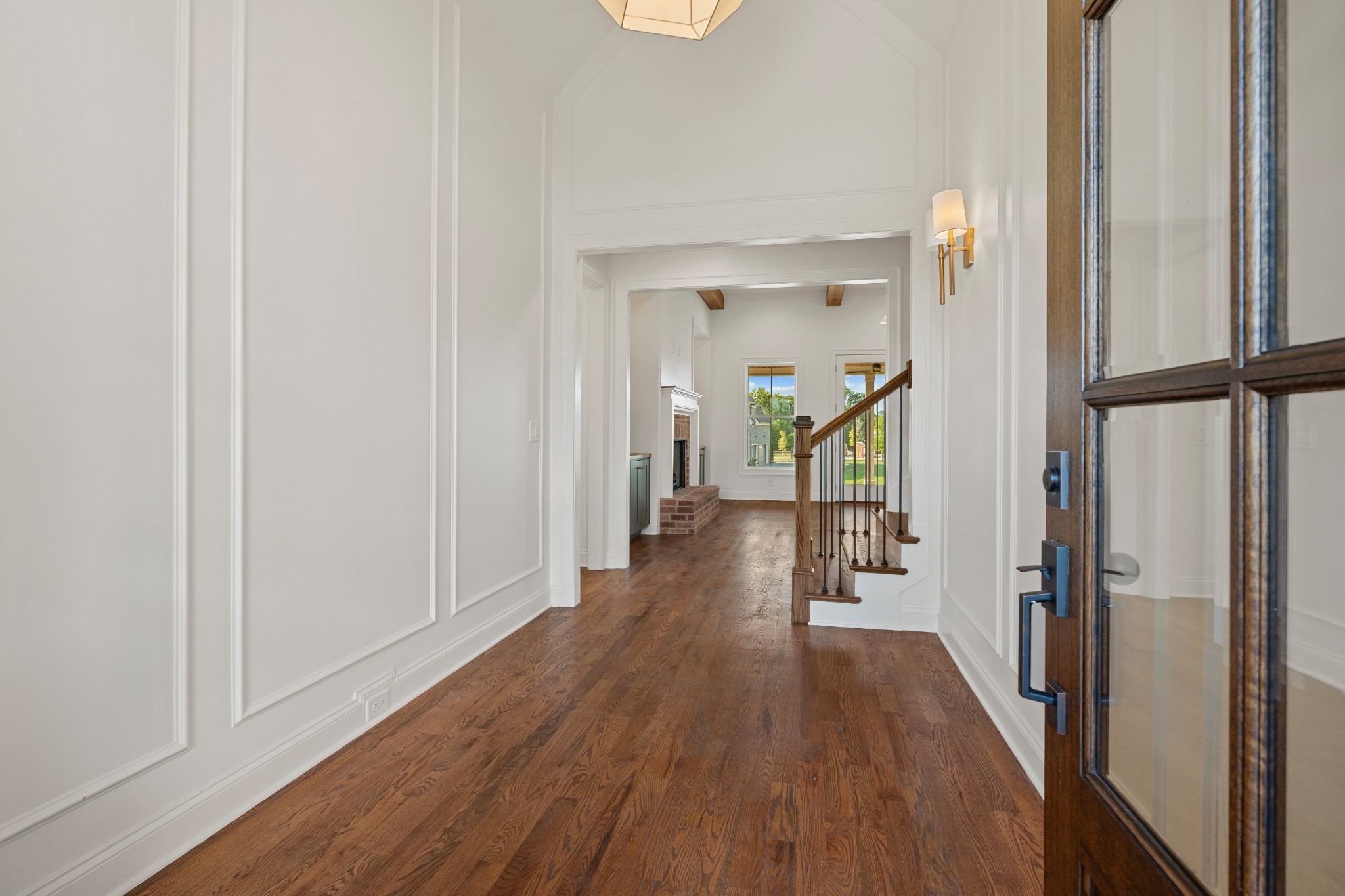 1107 Collin Drive Lebanon, TN 37087 - Photo 6 of 56 a view of a hallway with wooden floor and staircase