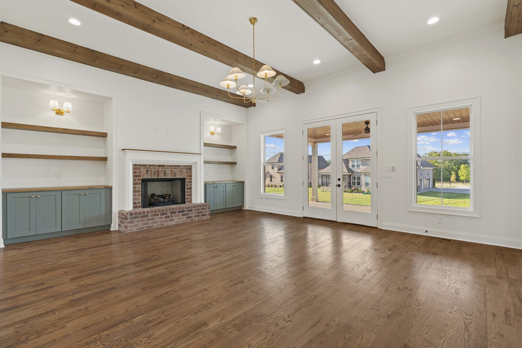 1107 Collin Drive Lebanon, TN 37087 - Photo 8 of 56 an empty room with windows fireplace and a flat screen tv