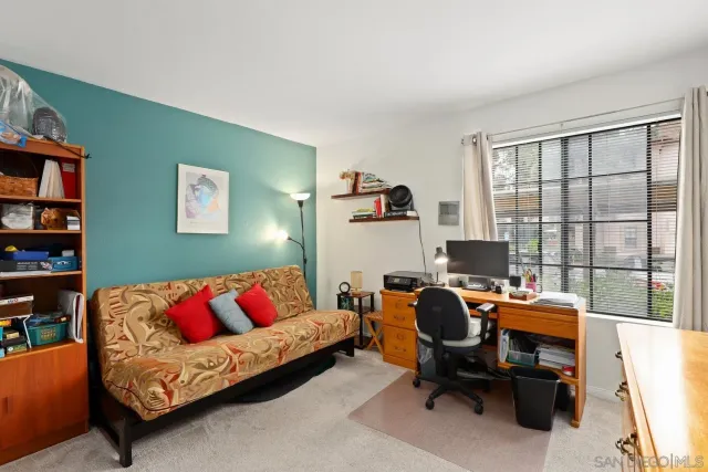 a workspace with furniture and a book shelf
