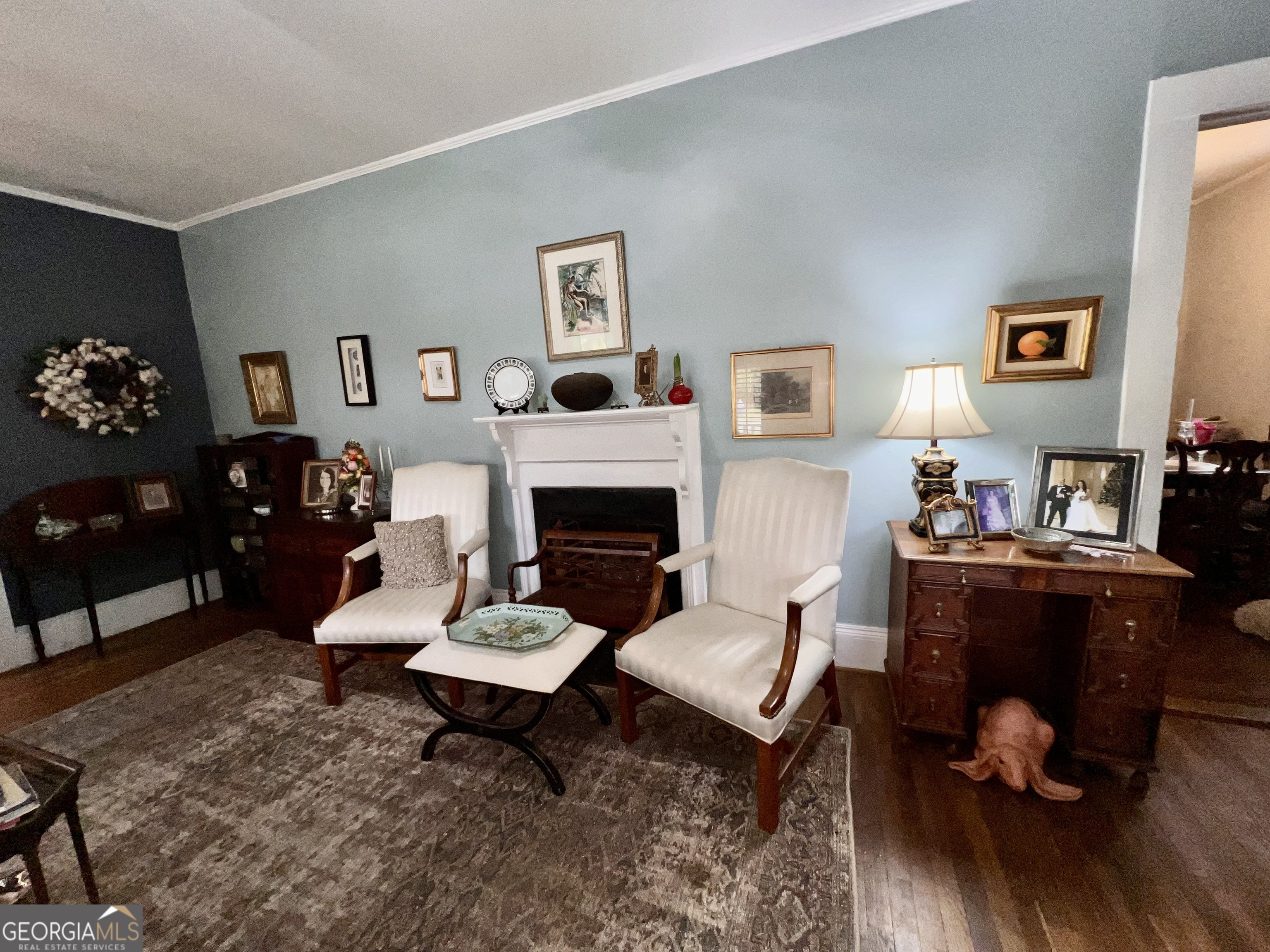 600 Foster Street Madison, GA 30650 - Photo 6 of 54 a living room with furniture and a fireplace