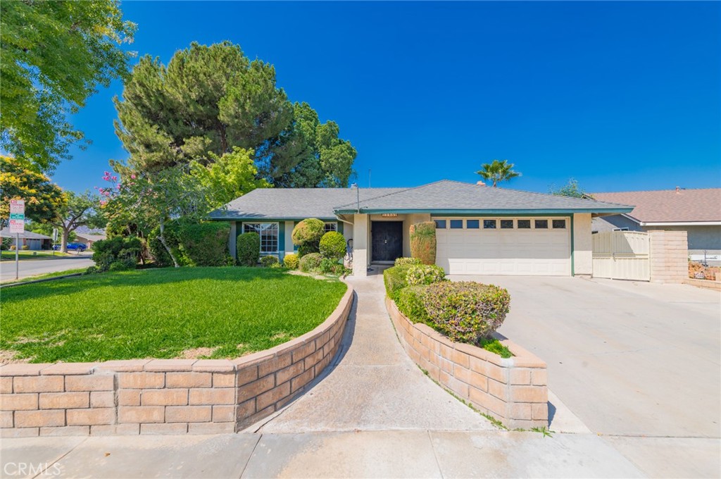 11151 Acheson Way Riverside, CA 92505 - Photo 1 of 1 a front view of a house with a garden