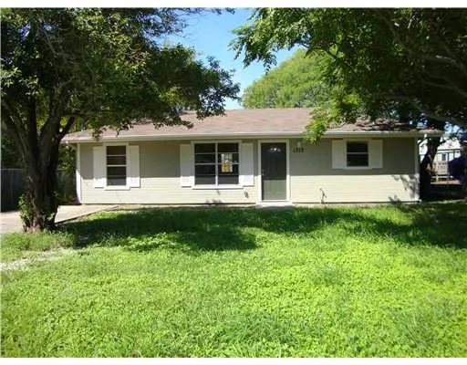 a view of a house with backyard sitting area and garden