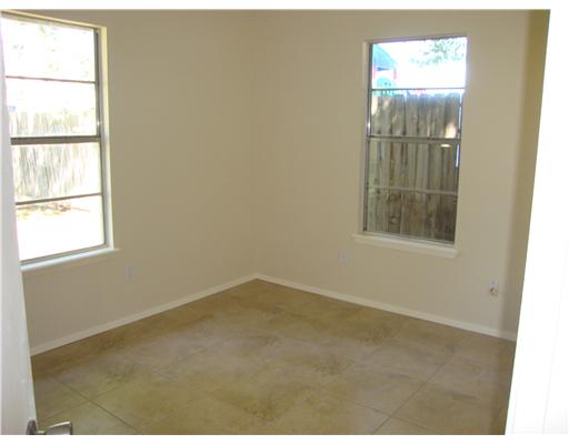 1313 7th Street Corpus Christi, TX 78404 - Photo 5 of 7 an empty room with windows