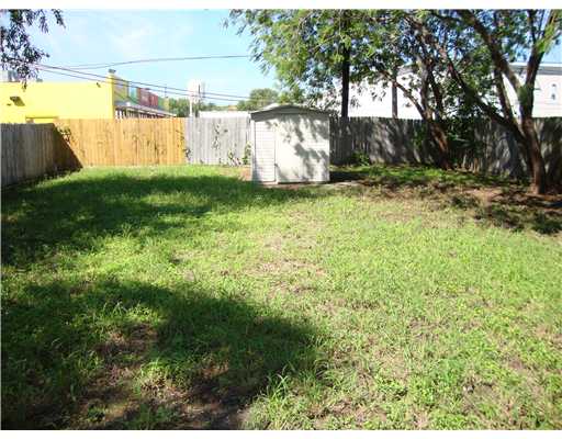 1313 7th Street Corpus Christi, TX 78404 - Photo 7 of 7 a view of a yard with large trees