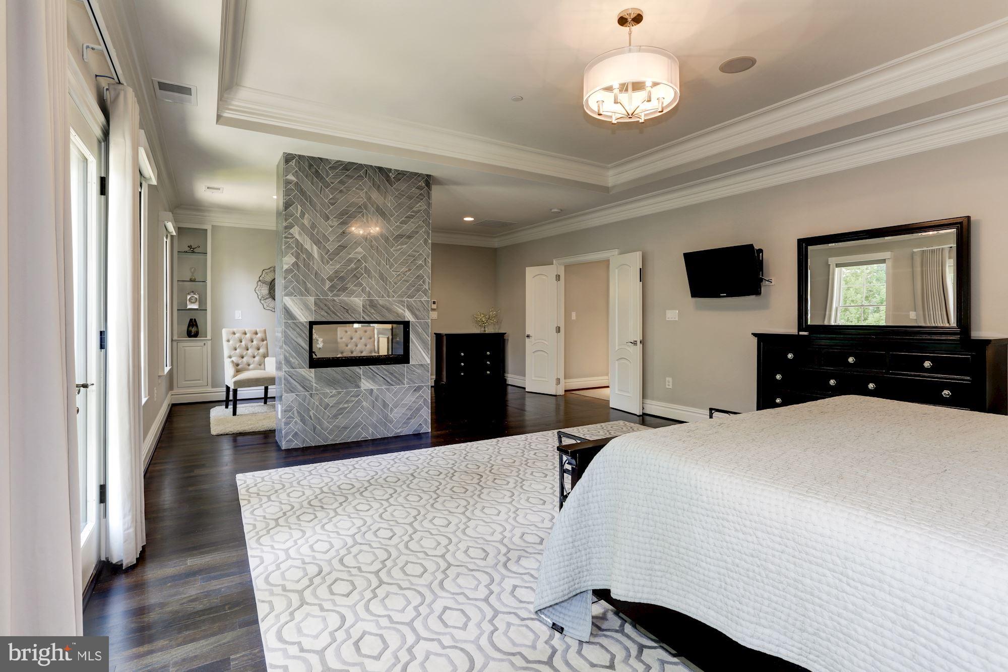 5313 Wehawken Road Bethesda, MD 20816 - Photo 20 of 50 Gas fireplace with Palissandro Bluette Marble tile