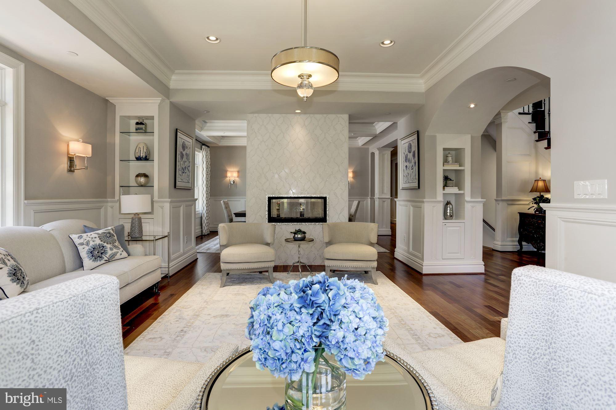 5313 Wehawken Road Bethesda, MD 20816 - Photo 5 of 50 Two-sided glass fireplace with tile mosaics