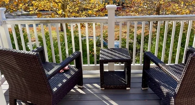 a view of a balcony with chairs