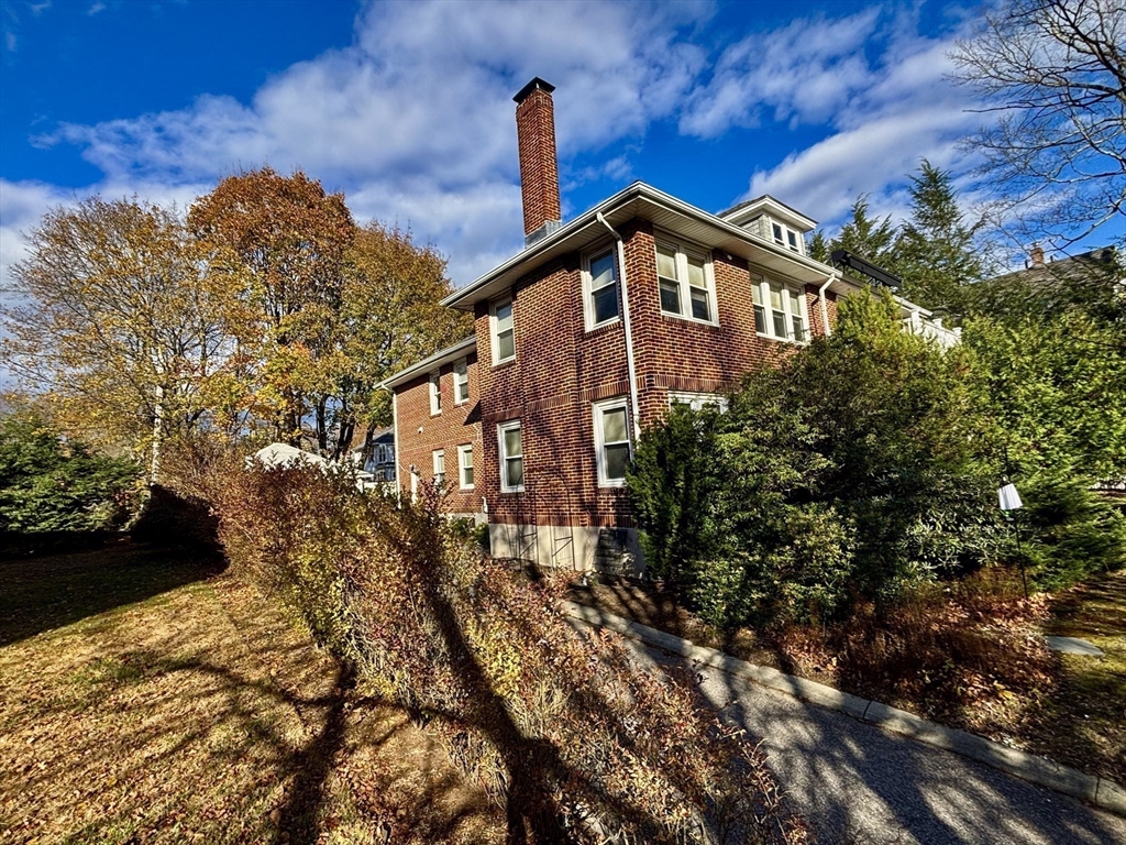 569 Commonwealth Avenue, Unit 2 Newton, MA 02459 - Photo 3 of 21 a front view of a house with a yard