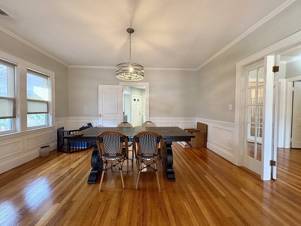 569 Commonwealth Avenue, Unit 2 Newton, MA 02459 - Photo 8 of 21 a view of a dining room with furniture window and wooden floor