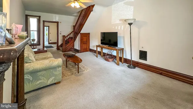 a view of a livingroom with furniture and a flat screen tv