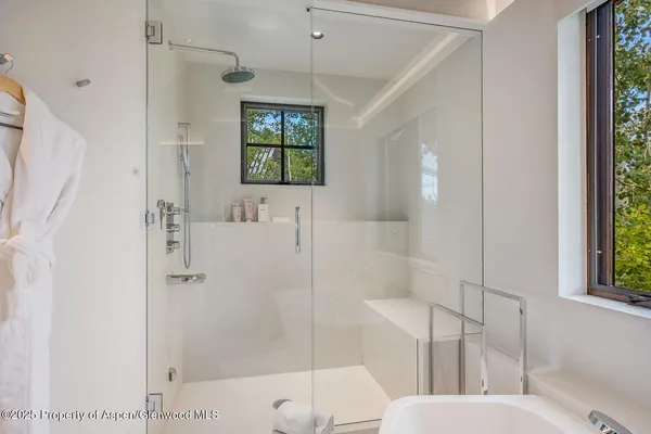 a kitchen with a stove a sink and a window
