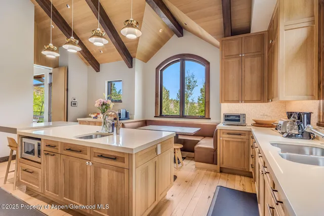 a living room with furniture and large windows