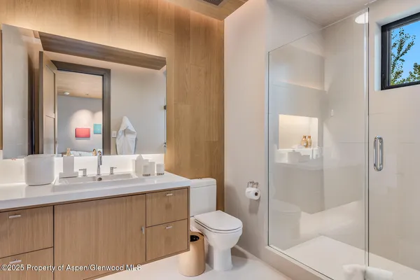 a bed room with a bed and a chair