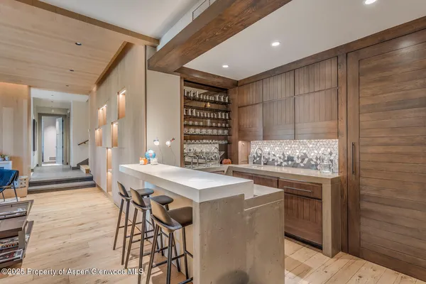 a view of a livingroom with workspace and windows