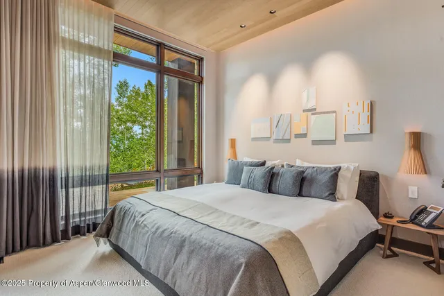 a view of house with roof deck outdoor seating and green space